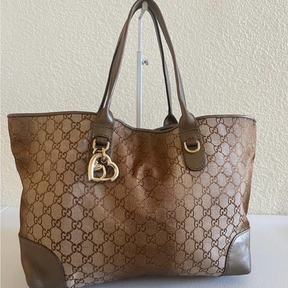 Gucci Handbags - Gucci Brown GG Canvas Tote with Gold Heart Charm